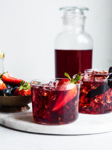 Bachelor's jam poured over ice garnished with berries