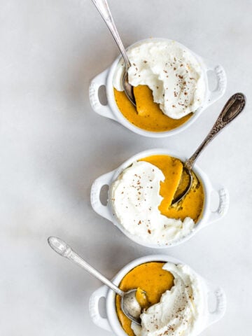 three small bowls of pumpkin custard