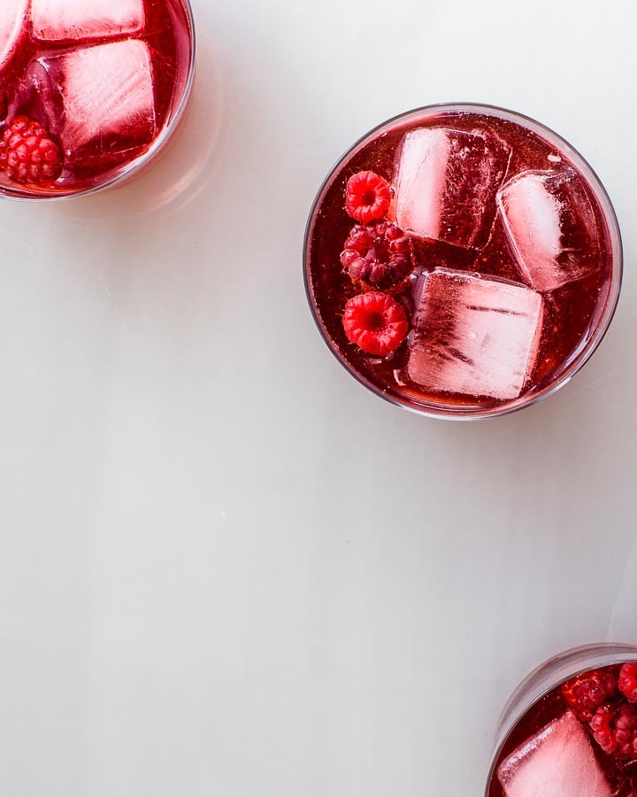 raspberry shrub in glasses with ice