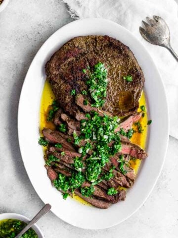 cooked flank steak on a plate
