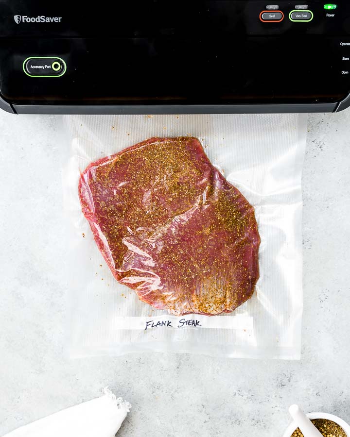 Vacuum sealing flank steak with a FoodSaver vacuum sealer.