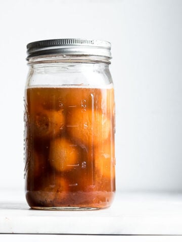 wild yeast in a jar on a white background